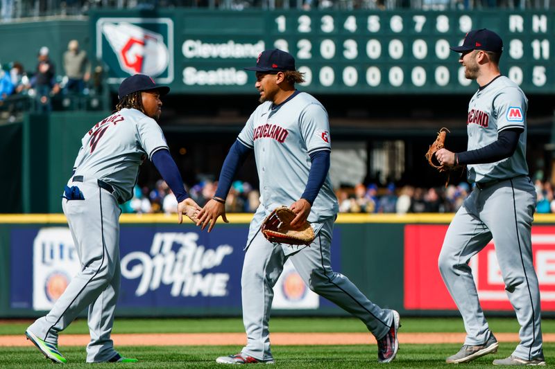 Apr 3, 2024; Seattle, Washington, USA; Cleveland Guardians designated hitter Jose Ramirez (11, left) celebrates with first baseman Josh Naylor (22, middle) and first baseman David Fry (6, right) following an 8-0 victory against the Seattle Mariners at T-Mobile Park. Mandatory Credit: Joe Nicholson-USA TODAY Sports