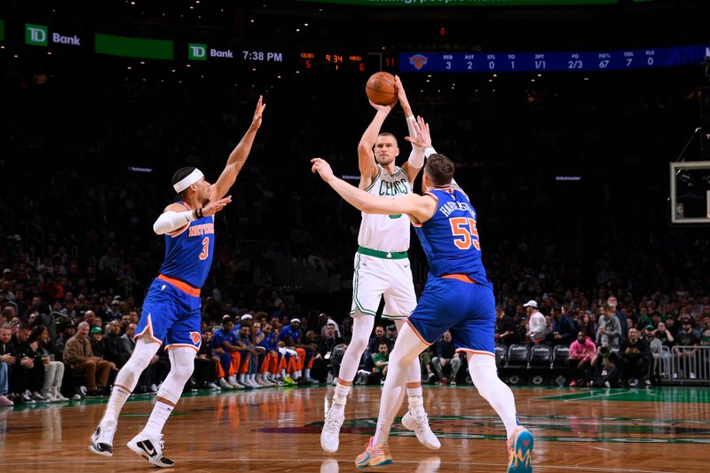 BOSTON, MA - APRIL 11: Kristaps Porzingis #8 of the Boston Celtics shoots a three point basket during the game against the New York Knicks on April 11, 2024 at the TD Garden in Boston, Massachusetts. NOTE TO USER: User expressly acknowledges and agrees that, by downloading and or using this photograph, User is consenting to the terms and conditions of the Getty Images License Agreement. Mandatory Copyright Notice: Copyright 2024 NBAE  (Photo by Brian Babineau/NBAE via Getty Images)