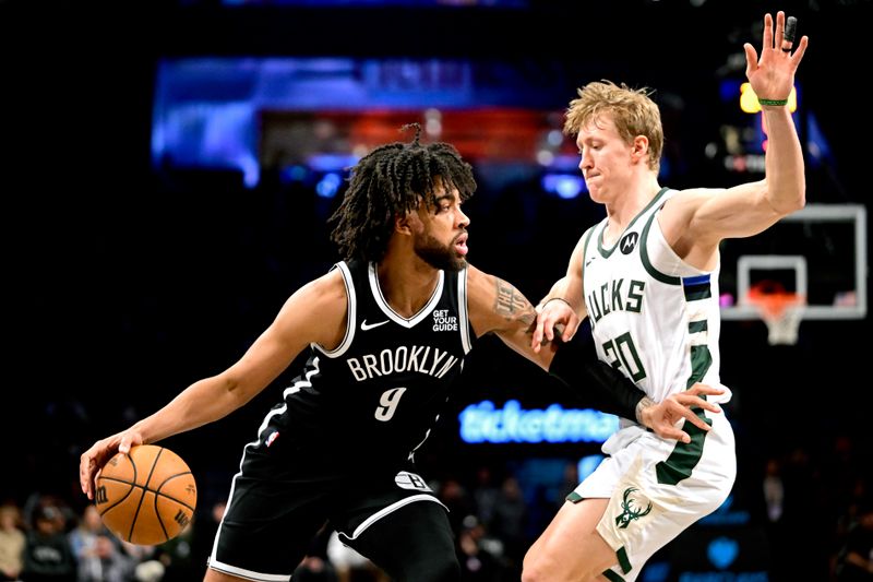 NEW YORK, NEW YORK - DECEMBER 08: Trendon Watford #9 of the Brooklyn Nets is defended by AJ Green #20 of the Milwaukee Bucks during the second half at Barclays Center on December 08, 2024 in New York City. NOTE TO USER: User expressly acknowledges and agrees that, by downloading and or using this Photograph, user is consenting to the terms and conditions of the Getty Images License Agreement. (Photo by Steven Ryan/Getty Images)