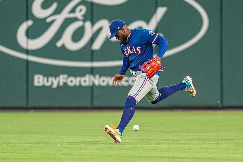 Apr 21, 2024; Cumberland, Georgia, USA; Texas Rangers right fielder Adolis Garcia (53)  commits an error on a fly ball hit by Atlanta Braves center fielder Michael Harris II (23) (not shown) during the eighth inning at Truist Park. Mandatory Credit: Dale Zanine-USA TODAY Sports
