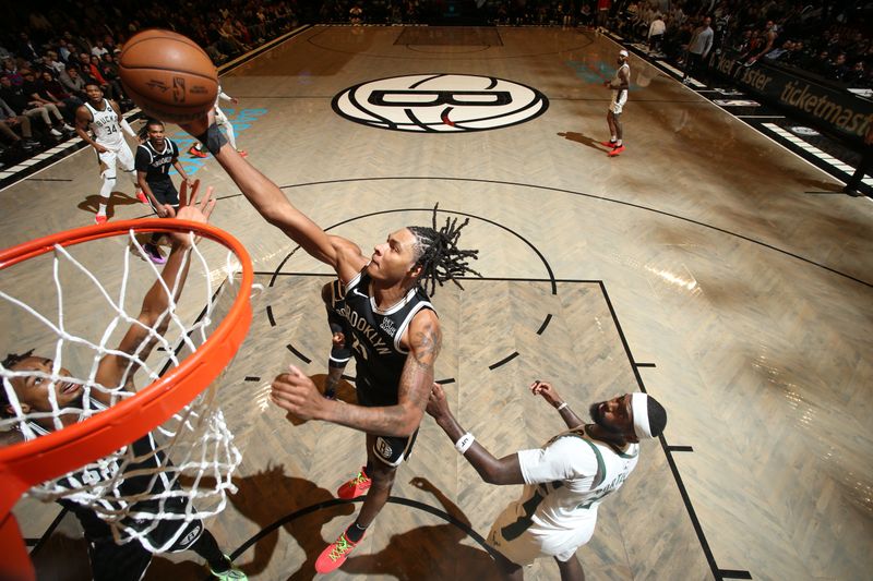 BROOKLYN, NY - OCTOBER 27: Noah Clowney #21 of the Brooklyn Nets  goes up for the rebound during the game against the Milwaukee Bucks on October 27, 2024 at Barclays Center in Brooklyn, New York. NOTE TO USER: User expressly acknowledges and agrees that, by downloading and or using this Photograph, user is consenting to the terms and conditions of the Getty Images License Agreement. Mandatory Copyright Notice: Copyright 2024 NBAE (Photo by Nathaniel S. Butler/NBAE via Getty Images)