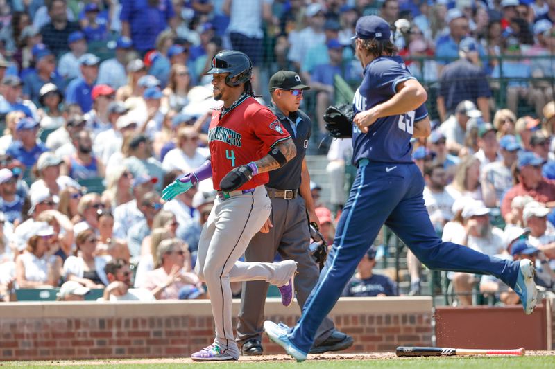 Jul 19, 2024; Chicago, Illinois, USA; Arizona Diamondbacks second baseman Ketel Marte (4) scores against the Chicago Cubs during the third inning at Wrigley Field. Mandatory Credit: Kamil Krzaczynski-USA TODAY Sports