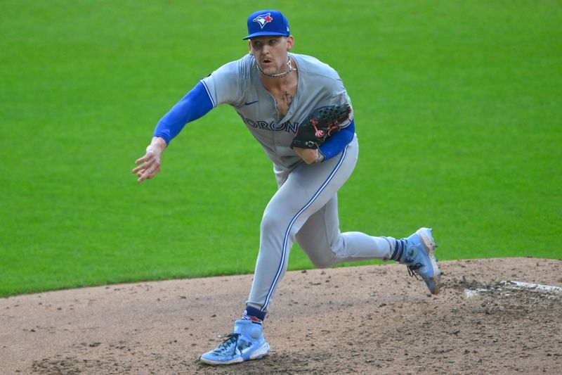 Jun 21, 2024; Cleveland, Ohio, USA; Toronto Blue Jays relief pitcher Bowden Francis (44) follows through on a pitch in the second inning against the Cleveland Guardians at Progressive Field. Mandatory Credit: David Richard-USA TODAY Sports