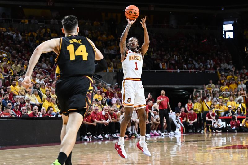Mar 7, 2026; Ames, Iowa, USA; Iowa State Cyclones guard Jamarion Batemon (1) shoots the ball as Arizona State Sun Devils forward Andrija Grbovic (14) looks to defend during the first half at James H. Hilton Coliseum. Mandatory Credit: Jeffrey Becker-Imagn Images