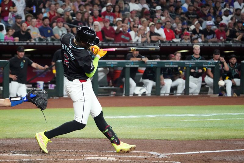 Sep 1, 2024; Phoenix, Arizona, USA; Arizona Diamondbacks shortstop Geraldo Perdomo (2) hits a two-RBI double against the Los Angeles Dodgers during the second inning at Chase Field. Mandatory Credit: Joe Camporeale-USA TODAY Sports