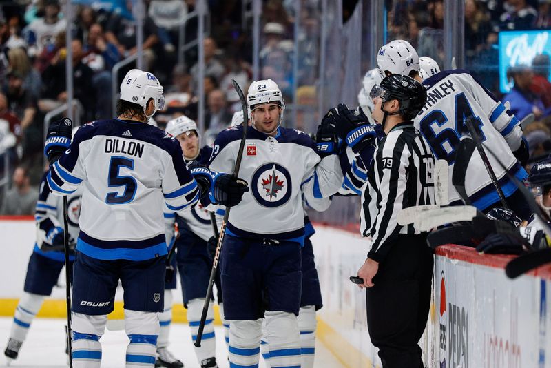 Apr 13, 2024; Denver, Colorado, USA; Winnipeg Jets center Sean Monahan (23) celebrates with teammates after his goal in the second period against the Colorado Avalanche at Ball Arena. Mandatory Credit: Isaiah J. Downing-USA TODAY Sports