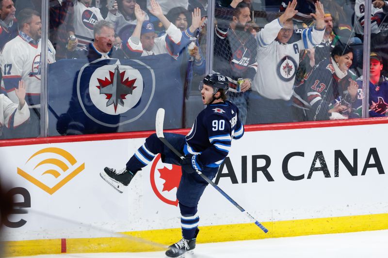 Apr 18, 2024; Winnipeg, Manitoba, CAN;  Winnipeg Jets forward Nikita Chibrikov (90) celebrates his first NHL goal against the Vancouver Canucks during the third period at Canada Life Centre. Mandatory Credit: Terrence Lee-USA TODAY Sports