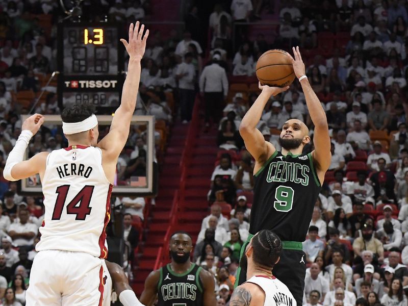 MIAMI, FL - APRIL 27: Derrick White #9 of the Boston Celtics shoots a three point basket against the Miami Heat during Round 1 Game 3 of the 2024 NBA Playoffs on April 27, 2024 at Kaseya Center in Miami, Florida. NOTE TO USER: User expressly acknowledges and agrees that, by downloading and or using this Photograph, user is consenting to the terms and conditions of the Getty Images License Agreement. Mandatory Copyright Notice: Copyright 2024 NBAE (Photo by Brian Babineau/NBAE via Getty Images)