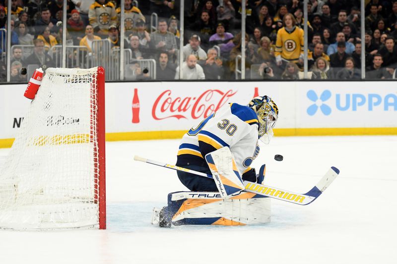 Mar 11, 2024; Boston, Massachusetts, USA;  St. Louis Blues goaltender Joel Hofer (30) makes a save during the first period against the Boston Bruins at TD Garden. Mandatory Credit: Bob DeChiara-USA TODAY Sports