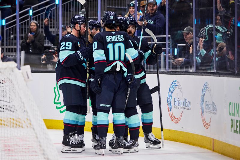 Dec 14, 2025; Seattle, Washington, USA; The Seattle Kraken celebrate after scoring a goal during the second period against the Buffalo Sabres at Climate Pledge Arena. Mandatory Credit: Blake Dahlin-Imagn Images