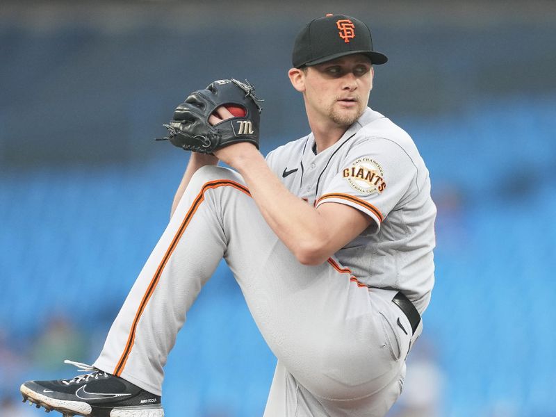 Jun 29, 2023; Toronto, Ontario, CAN; San Francisco Giants starting pitcher Keaton Winn (67) throws a pitch against the Toronto Blue Jays during the first inning at Rogers Centre. Mandatory Credit: Nick Turchiaro-USA TODAY Sports