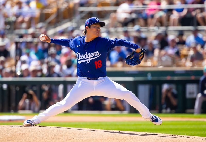 Mar 13, 2024; Phoenix, Arizona, USA; Los Angeles Dodgers pitcher Yoshinobu Yamamoto against the Seattle Mariners during a spring training game at Camelback Ranch-Glendale. Mandatory Credit: Mark J. Rebilas-USA TODAY Sports
