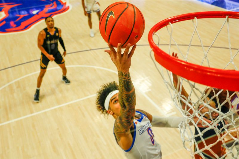 Feb 20, 2024; Boise, Idaho, USA;  Boise State Broncos guard Roddie Anderson III (0) drives to the basket during the second half against the San Jose State Spartans at ExtraMile Arena. Mandatory Credit: Brian Losness-USA TODAY Sports


