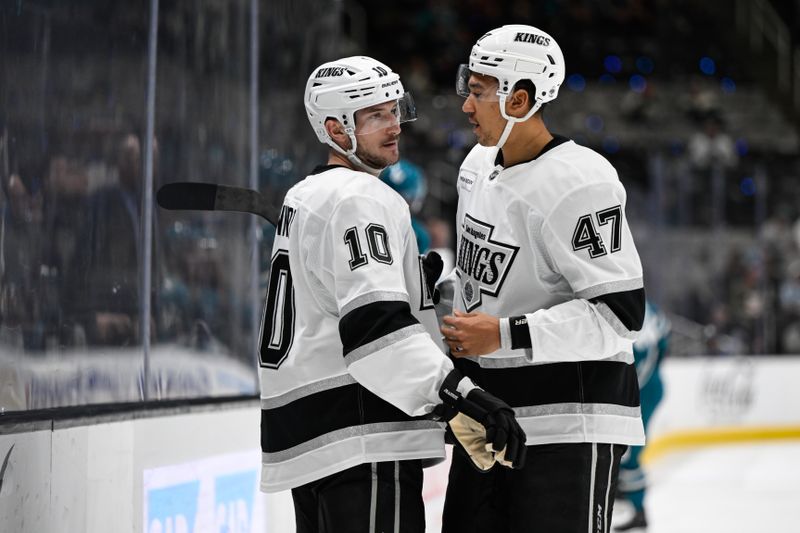 Oct 29, 2024; San Jose, California, USA; Los Angeles Kings left wing Tanner Jeannot (10) and left wing Andre Lee (47) talk during a break in play against the San Jose Sharks in the first period at SAP Center at San Jose. Mandatory Credit: Eakin Howard-Imagn Images