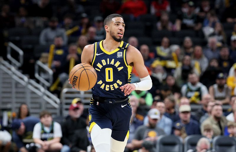 INDIANAPOLIS, INDIANA - FEBRUARY 06: Tyrese Haliburton #0 of the Indiana Pacers dribbles the ball in the first half of the 132-129 win over the Houston Rockets at Gainbridge Fieldhouse on February 06, 2024 in Indianapolis, Indiana.    NOTE TO USER: User expressly acknowledges and agrees that, by downloading and or using this photograph, User is consenting to the terms and conditions of the Getty Images License Agreement.  (Photo by Andy Lyons/Getty Images)