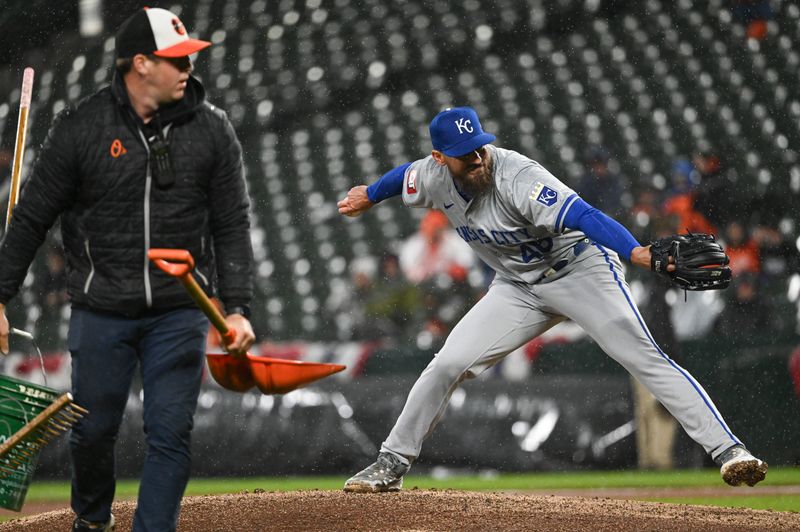 Apr 2, 2024; Baltimore, Maryland, USA;  Kansas City Royals starting pitcher Alec Marsh (48) delivers a pitch a Baltimore Orioles grounds crew leaves them during the eighth inning at Oriole Park at Camden Yards. Mandatory Credit: Tommy Gilligan-USA TODAY Sports