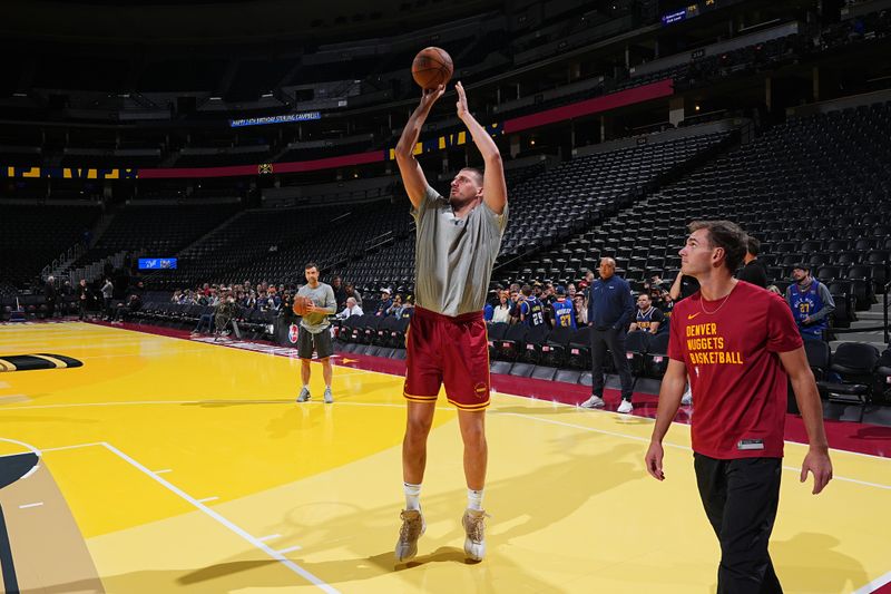 DENVER, CO - NOVEMBER 22: Nikola Jokic #15 of the Denver Nuggets warms up before the game against the Dallas Mavericks during the Emirates NBA Cup game on November 22, 2024 at Ball Arena in Denver, Colorado. NOTE TO USER: User expressly acknowledges and agrees that, by downloading and/or using this Photograph, user is consenting to the terms and conditions of the Getty Images License Agreement. Mandatory Copyright Notice: Copyright 2024 NBAE (Photo by Garrett Ellwood/NBAE via Getty Images)