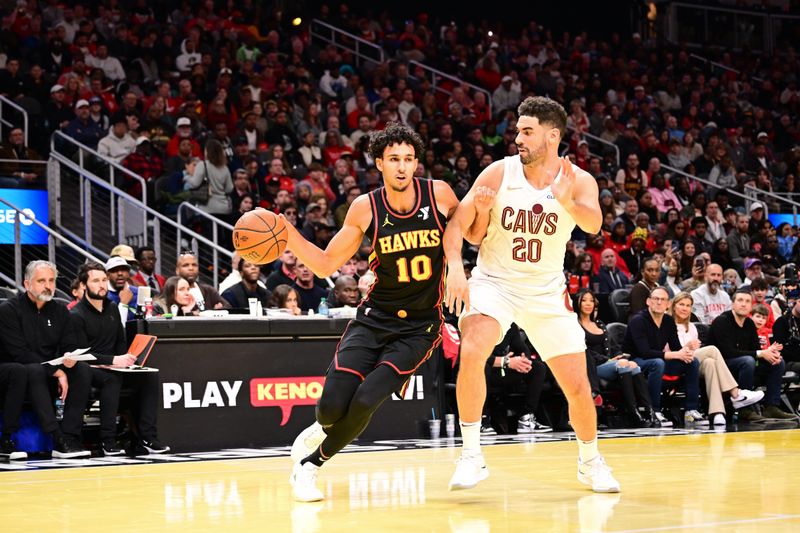 ATLANTA, GA - NOVEMBER 29: Zaccharie Risacher #10 of the Atlanta Hawks handles the ball during the game against the Cleveland Cavaliers during the Emirates NBA Cup game on November 29, 2024 at State Farm Arena in Atlanta, Georgia.  NOTE TO USER: User expressly acknowledges and agrees that, by downloading and/or using this Photograph, user is consenting to the terms and conditions of the Getty Images License Agreement. Mandatory Copyright Notice: Copyright 2024 NBAE (Photo by Adam Hagy/NBAE via Getty Images)