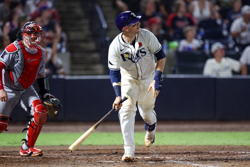 May 26, 2025; Tampa, Florida, USA; Tampa Bay Rays catcher Danny Jansen (19) hits a two run home run against the Minnesota Twins in the eighth inning at George M. Steinbrenner Field. Mandatory Credit: Nathan Ray Seebeck-Imagn Images