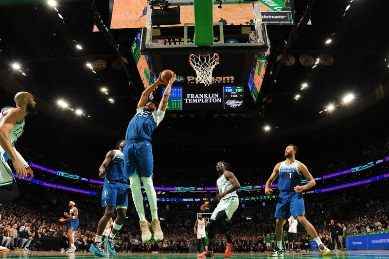 BOSTON, MA - JANUARY 10: Karl-Anthony Towns #32 of the Minnesota Timberwolves grabs the rebound during the game on January 10, 2024 at the TD Garden in Boston, Massachusetts. NOTE TO USER: User expressly acknowledges and agrees that, by downloading and or using this photograph, User is consenting to the terms and conditions of the Getty Images License Agreement. Mandatory Copyright Notice: Copyright 2024 NBAE  (Photo by Brian Babineau/NBAE via Getty Images)