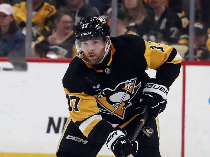 Apr 15, 2024; Pittsburgh, Pennsylvania, USA;  Pittsburgh Penguins right wing Bryan Rust (17) skates up ice with the puck against the Nashville Predators during the third period at PPG Paints Arena. The Penguins won 4-2. Mandatory Credit: Charles LeClaire-USA TODAY Sports