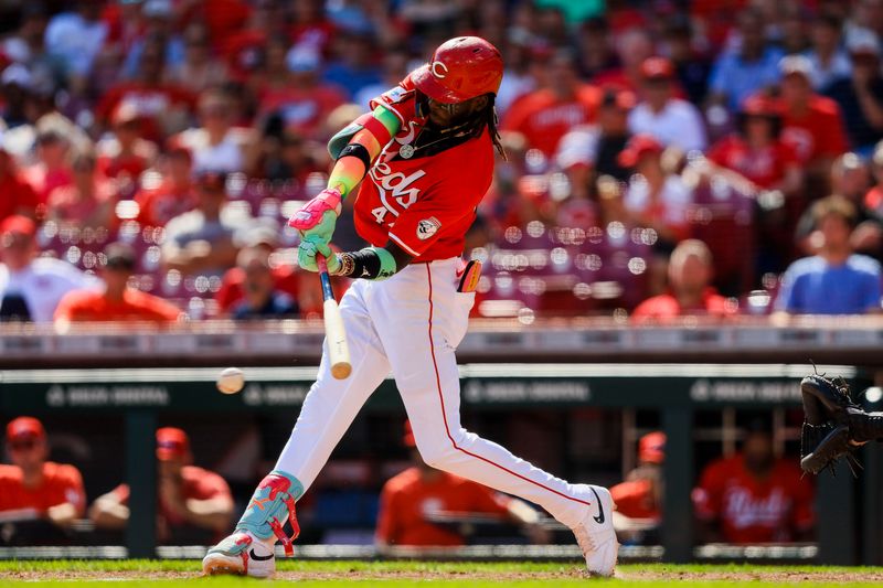 Sep 19, 2024; Cincinnati, Ohio, USA; Cincinnati Reds shortstop Elly De La Cruz (44) hits a RBI single in the seventh inning against the Atlanta Braves at Great American Ball Park. Mandatory Credit: Katie Stratman-Imagn Images