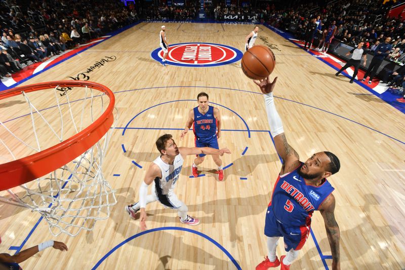 DETROIT, MI - FEBRUARY 4: Monte Morris #5  of the Detroit Pistons rebounds the ball during the game  against the Orlando Magic on February 4, 2024 at Little Caesars Arena in Detroit, Michigan. NOTE TO USER: User expressly acknowledges and agrees that, by downloading and/or using this photograph, User is consenting to the terms and conditions of the Getty Images License Agreement. Mandatory Copyright Notice: Copyright 2024 NBAE (Photo by Chris Schwegler/NBAE via Getty Images)