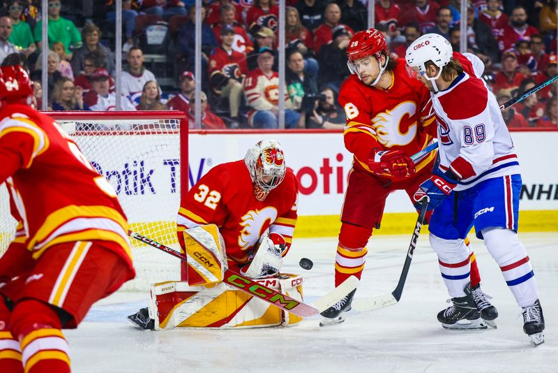 Mar 16, 2024; Calgary, Alberta, CAN; Calgary Flames goaltender Dustin Wolf (32) makes a save against the Montreal Canadiens during the first period at Scotiabank Saddledome. Mandatory Credit: Sergei Belski-USA TODAY Sports