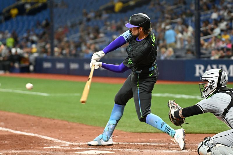 May 7, 2024; St. Petersburg, Florida, USA; Tampa Bay Rays right fielder Josh Lowe (15) hits a single in the seventh inning against the Chicago White Sox  at Tropicana Field. Mandatory Credit: Jonathan Dyer-USA TODAY Sports