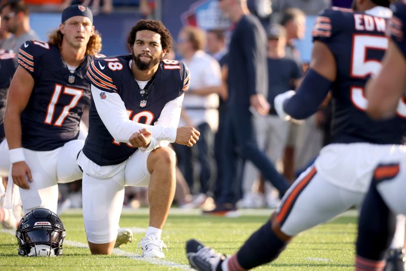 Chicago Bears quarterback Caleb Williams (18) warms up prior to the start of an NFL preseason football game against the Houston Texans, Thursday Aug. 21, 2024, in Canton, Ohio. (AP Photo/Kirk Irwin)