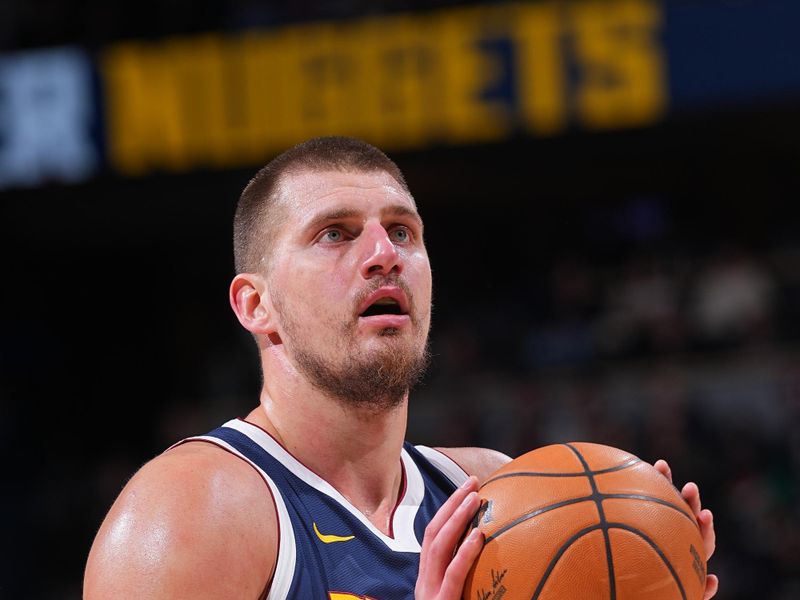 DENVER, CO - DECEMBER 13:  Nikola Jokic #15 of the Denver Nuggets shoots a free throw during the game against the LA Clippers on December 13, 2024 at Ball Arena in Denver, Colorado. NOTE TO USER: User expressly acknowledges and agrees that, by downloading and/or using this Photograph, user is consenting to the terms and conditions of the Getty Images License Agreement. Mandatory Copyright Notice: Copyright 2024 NBAE (Photo by Bart Young/NBAE via Getty Images)