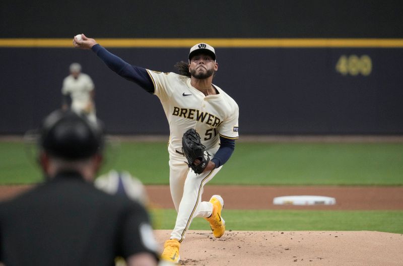 May 18, 2025; Milwaukee, Wisconsin, USA; Milwaukee Brewers pitcher Freddy Peralta (51) delivers a pitch in the first inning against the Minnesota Twins at American Family Field. Mandatory Credit: Michael McLoone-Imagn Images