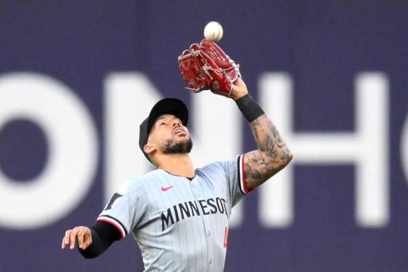 Sep 18, 2024; Cleveland, Ohio, USA; Minnesota Twins shortstop Carlos Correa (4) catches a fly ball in the first inning against the Cleveland Guardians at Progressive Field. Mandatory Credit: David Richard-Imagn Images
