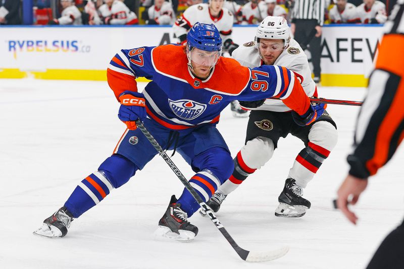 Jan 6, 2024; Edmonton, Alberta, CAN; Edmonton Oilers forward Connor McDavid (97) carries the puck around Ottawa Senators defensemen Erik Brannstrom (26) during the first period at Rogers Place. Mandatory Credit: Perry Nelson-USA TODAY Sports