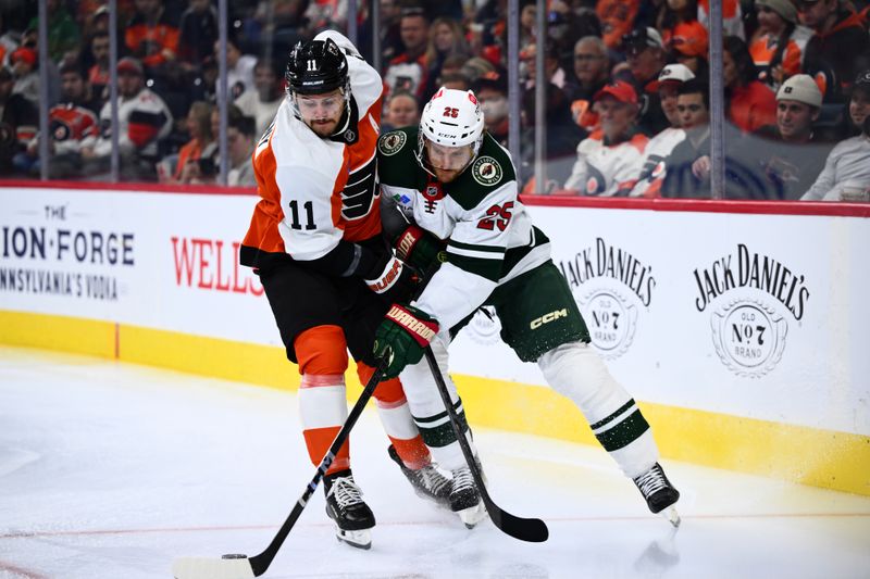 Oct 26, 2024; Philadelphia, Pennsylvania, USA; Philadelphia Flyers right wing Travis Konecny (11) and Minnesota Wild defenseman Jonas Brodin (25) battle for the puck in the first period at Wells Fargo Center. Mandatory Credit: Kyle Ross-Imagn Images