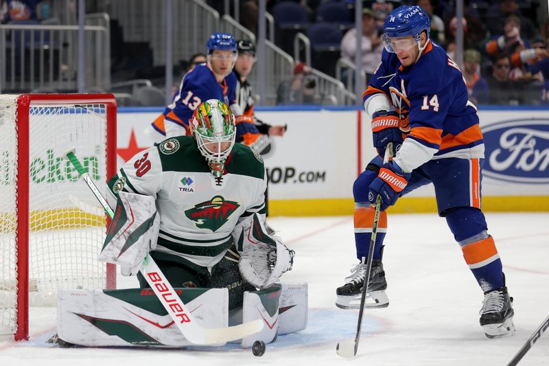 Nov 7, 2025; Elmont, New York, USA; Minnesota Wild goaltender Jesper Wallstedt (30) makes a save against New York Islanders center Bo Horvat (14) during the second period at UBS Arena. Mandatory Credit: Brad Penner-Imagn Images