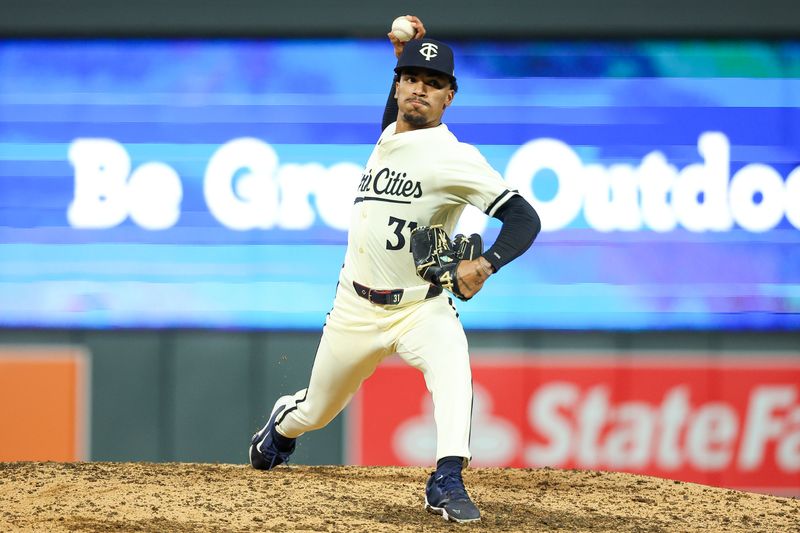 Aug 28, 2024; Minneapolis, Minnesota, USA; Minnesota Twins relief pitcher Ronny Henriquez (31) delivers a pitch against the Atlanta Braves during the ninth inning at Target Field. Mandatory Credit: Matt Krohn-USA TODAY Sports