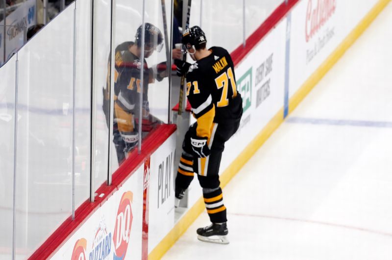 Oct 26, 2023; Pittsburgh, Pennsylvania, USA; Pittsburgh Penguins center Evgeni Malkin (71) steps into the penalty box to serve a four minute slashing penalty against the Colorado Avalanche during the second period at PPG Paints Arena. The Penguins shutout the Avalanche 4-0. Mandatory Credit: Charles LeClaire-USA TODAY Sports