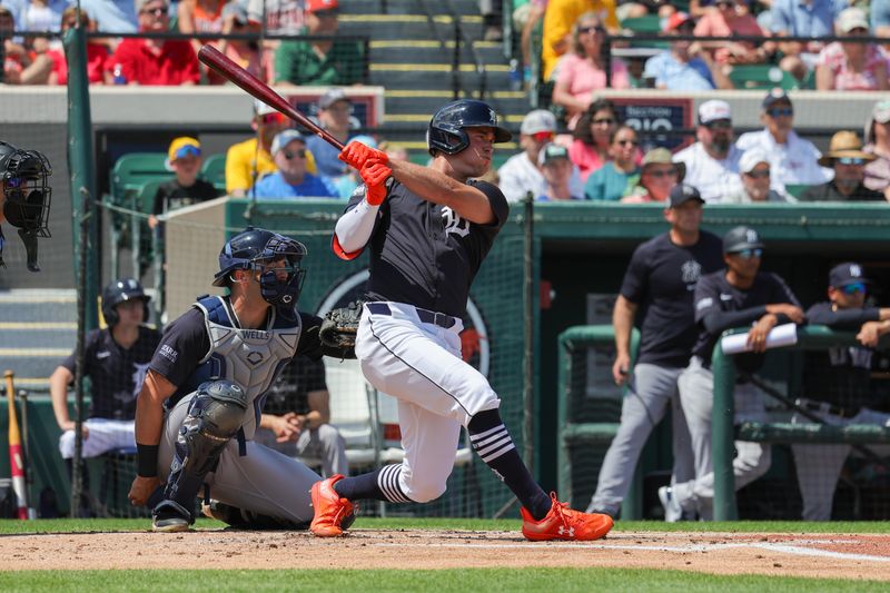 Mar 23, 2024; Lakeland, Florida, USA; Detroit Tigers right fielder Kerry Carpenter (30) hits an RBI single during the first inning against the New York Yankees at Publix Field at Joker Marchant Stadium. Mandatory Credit: Mike Watters-USA TODAY Sports