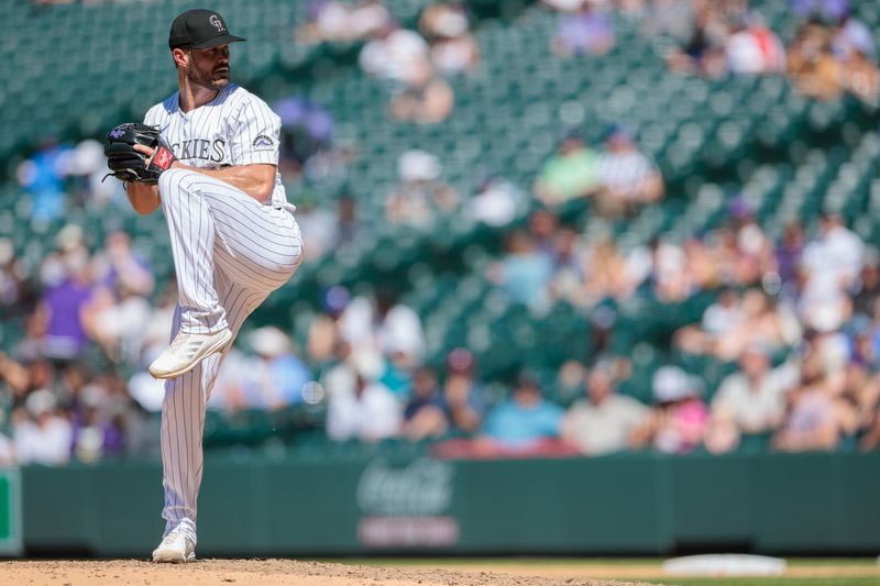 Jun 5, 2024; Denver, Colorado, USA; Colorado Rockies relief pitcher Tyler Kinley (40) delivers a pitch during the eighth inning against the Cincinnati Reds at Coors Field. Mandatory Credit: Andrew Wevers-USA TODAY Sports
