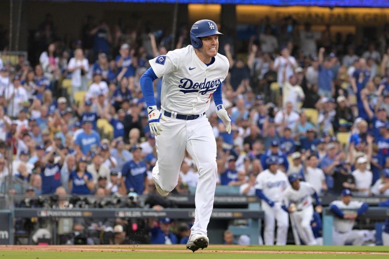 Oct 11, 2024; Los Angeles, California, USA; Los Angeles Dodgers first baseman Freddie Freeman (5) runs after hitting a single in the first inning during game five of the NLDS for the 2024 MLB Playoffs at Dodger Stadium. Mandatory Credit: Jayne Kamin-Oncea-Imagn Images