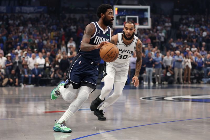 DALLAS, TEXAS - OCTOBER 24: Kyrie Irving #11 of the Dallas Mavericks drives against Julian Champagnie #30 of the San Antonio Spurs during the first quarter of the game at American Airlines Center on October 24, 2024 in Dallas, Texas.  NOTE TO USER: User expressly acknowledges and agrees that, by downloading and or using this photograph, User is consenting to the terms and conditions of the Getty Images License Agreement. (Photo by Sam Hodde/Getty Images)