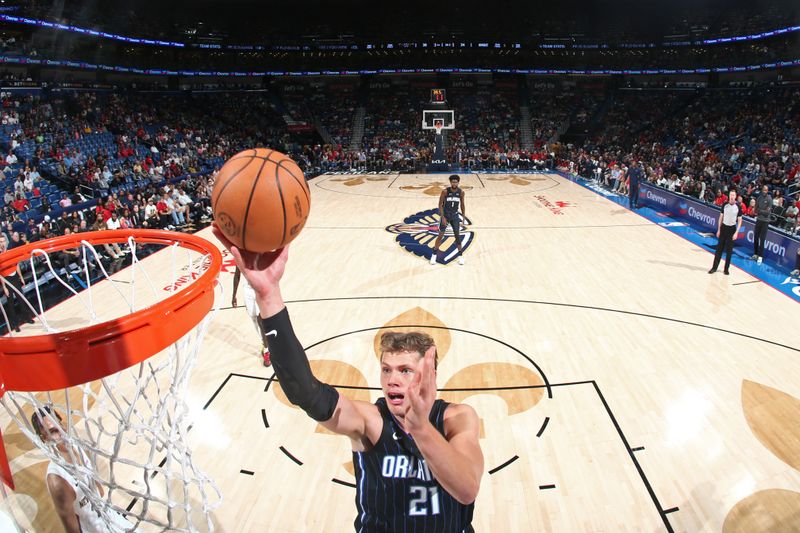 NEW ORLEANS, LA - OCTOBER 10: Moritz Wagner #21 of the Orlando Magic drives to the basket during the game against the New Orleans Pelicans  on October 10, 2023 at the Smoothie King Center in New Orleans, Louisiana. NOTE TO USER: User expressly acknowledges and agrees that, by downloading and or using this Photograph, user is consenting to the terms and conditions of the Getty Images License Agreement. Mandatory Copyright Notice: Copyright 2023 NBAE (Photo by Layne Murdoch Jr./NBAE via Getty Images)
