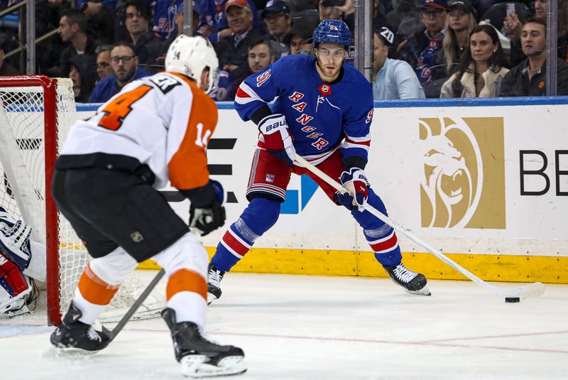 Apr 11, 2024; New York, New York, USA; New York Rangers center Alex Wennberg (91) looks to make a pass past Philadelphia Flyers center Sean Couturier (14) during the second period at Madison Square Garden. Mandatory Credit: Danny Wild-USA TODAY Sports