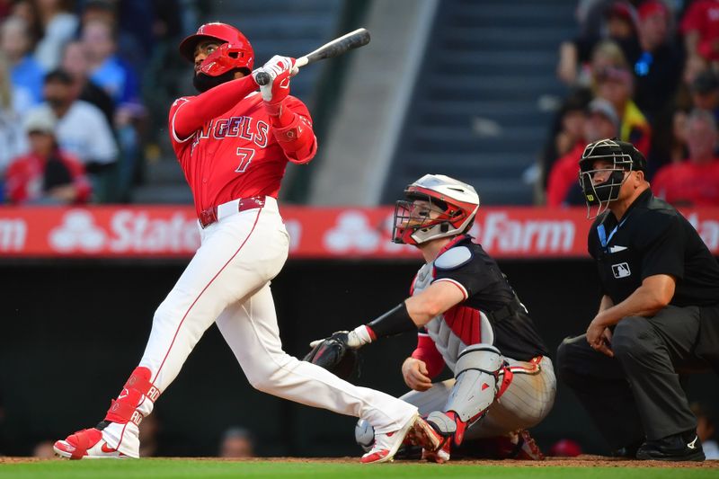 Apr 27, 2024; Anaheim, California, USA; Los Angeles Angels right fielder Jo Adell (7) hits a two run home run against the Minnesota Twins during the second inning at Angel Stadium. Mandatory Credit: Gary A. Vasquez-USA TODAY Sports