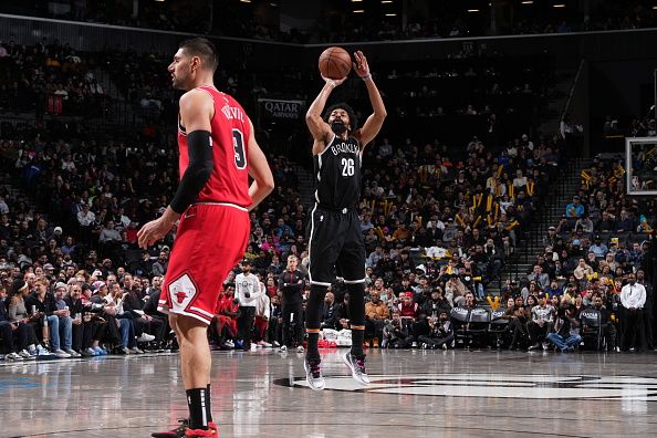 BROOKLYN, NY - NOVEMBER 26: Spencer Dinwiddie #26 of the Brooklyn Nets shoots a three point basket against the Chicago Bulls on November 26, 2023 at Barclays Center in Brooklyn, New York. NOTE TO USER: User expressly acknowledges and agrees that, by downloading and or using this Photograph, user is consenting to the terms and conditions of the Getty Images License Agreement. Mandatory Copyright Notice: Copyright 2023 NBAE (Photo by Jesse D. Garrabrant/NBAE via Getty Images)