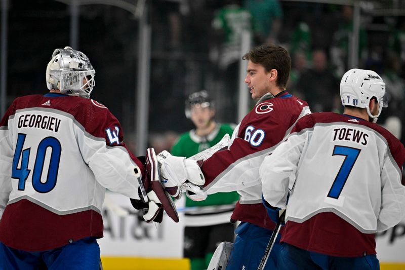 May 7, 2024; Dallas, Texas, USA; Colorado Avalanche goaltender Alexandar Georgiev (40) and defenseman Devon Toews (7) and goaltender Justus Annunen (60) celebrate the win over the Dallas Stars in the overtime period in game one of the second round of the 2024 Stanley Cup Playoffs at American Airlines Center. Mandatory Credit: Jerome Miron-USA TODAY Sports