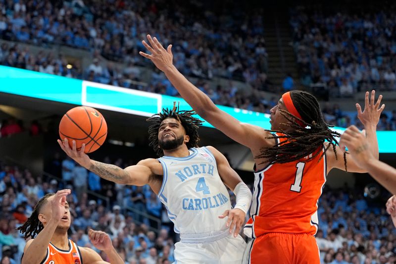 Jan 13, 2024; Chapel Hill, North Carolina, USA;  North Carolina Tar Heels guard RJ Davis (4) shoots as Syracuse Orange forward Maliq Brown (1) defends in the second half at Dean E. Smith Center. Mandatory Credit: Bob Donnan-USA TODAY Sports