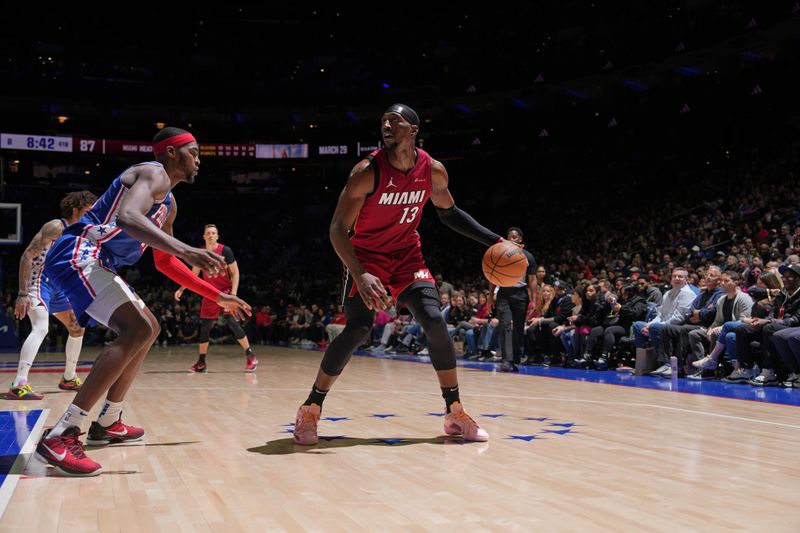 PHILADELPHIA, PA - FEBRUARY 14: Bam Adebayo #13 of the Miami Heat dribbles the ball during the game against the Philadelphia 76ers on February 14, 2024 at the Wells Fargo Center in Philadelphia, Pennsylvania NOTE TO USER: User expressly acknowledges and agrees that, by downloading and/or using this Photograph, user is consenting to the terms and conditions of the Getty Images License Agreement. Mandatory Copyright Notice: Copyright 2024 NBAE (Photo by Jesse D. Garrabrant/NBAE via Getty Images)