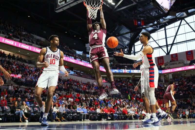 Feb 18, 2023; Oxford, Mississippi, USA; Mississippi State Bulldogs guard/forward Cameron Matthews (4) dunks during the first half against the Mississippi Rebels at The Sandy and John Black Pavilion at Ole Miss. Mandatory Credit: Petre Thomas-USA TODAY Sports